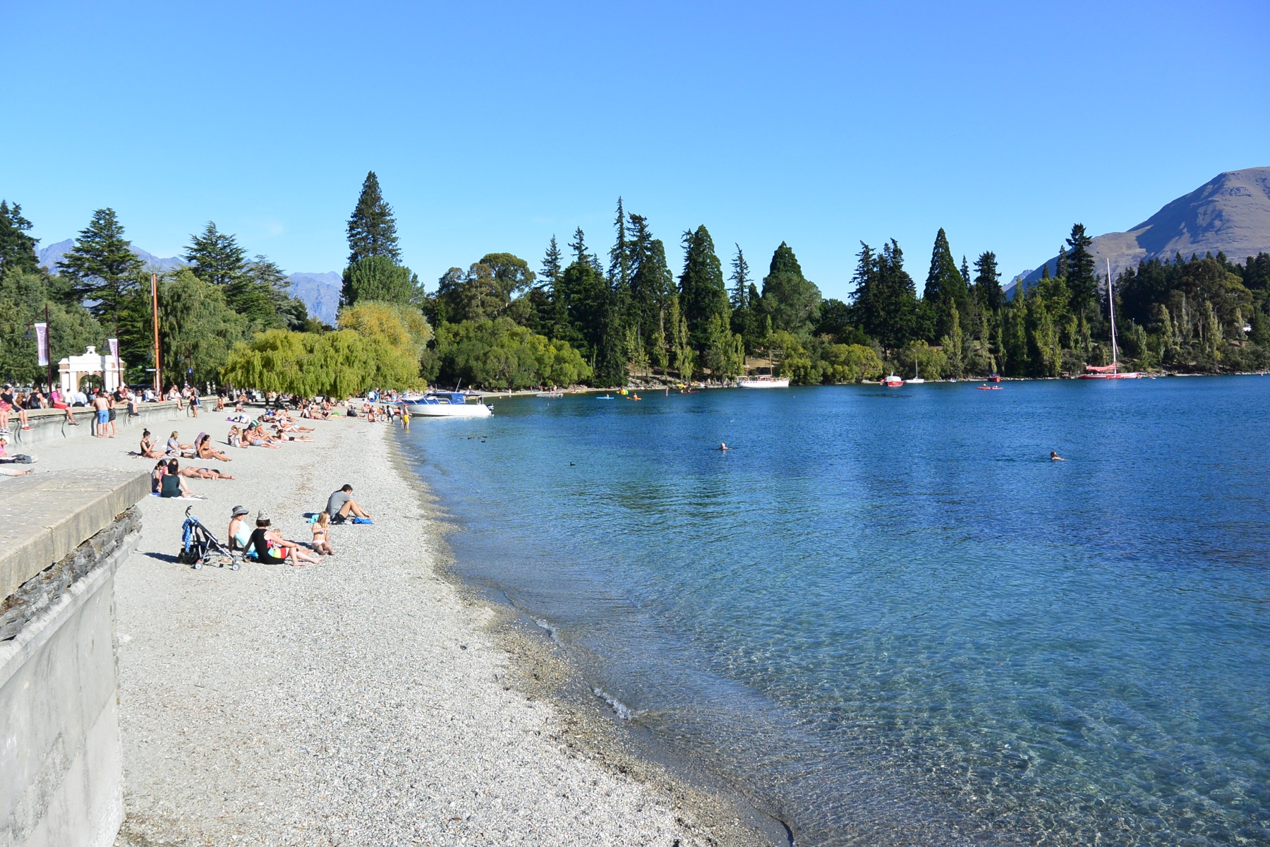 Temperate lake beach with mountain water